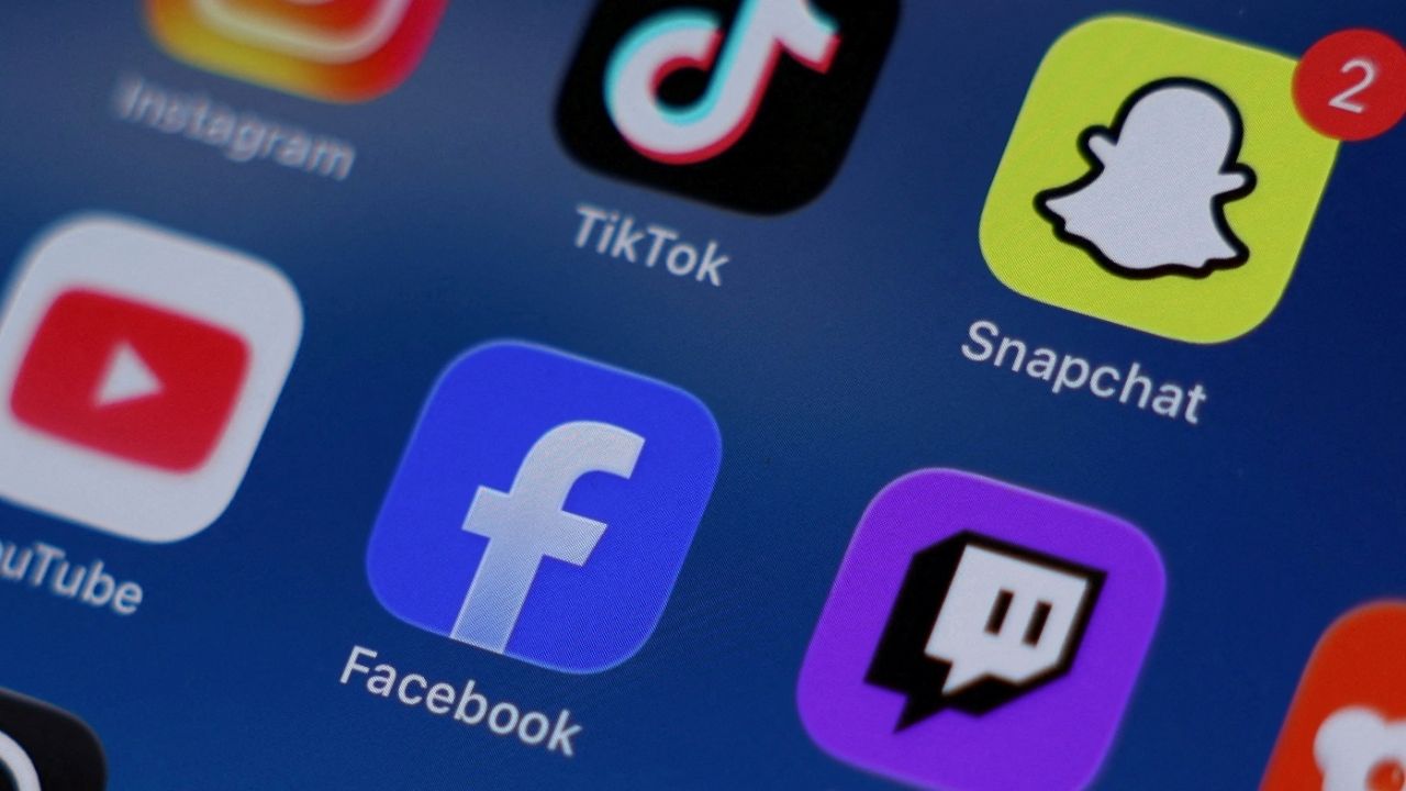 Instagram, TikTok, Snapchat, YouTube, Facebook, Twitch and Reddit applications are displayed on a mobile phone in this picture illustration taken on December 9, 2025. (Reuters File)