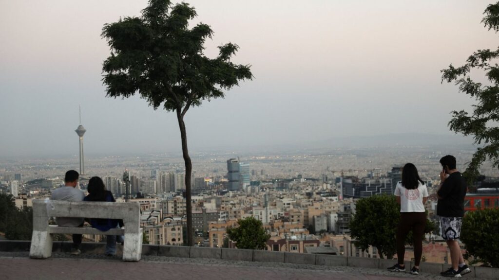 Iranian people in a park with a view of Milad Tower, in Tehran, Iran, June 15, 2026. Majid Asgaripour/WANA (West Asia News Agency) via Reuters