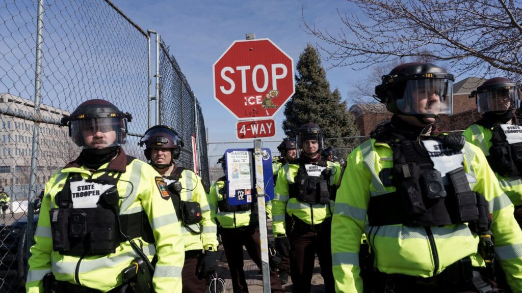 Local law enforcement stand guard after declaring an unlawful assembly during a demonstration against ongoing Immigration and Customs Enforcement (ICE) operations outside the Whipple Federal Building, in Fort Snelling, Minnesota, U.S., March 1, 2026. REUTERS/Tim Evans