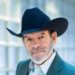 Portrait of Robert Frobose in a black cowboy hat