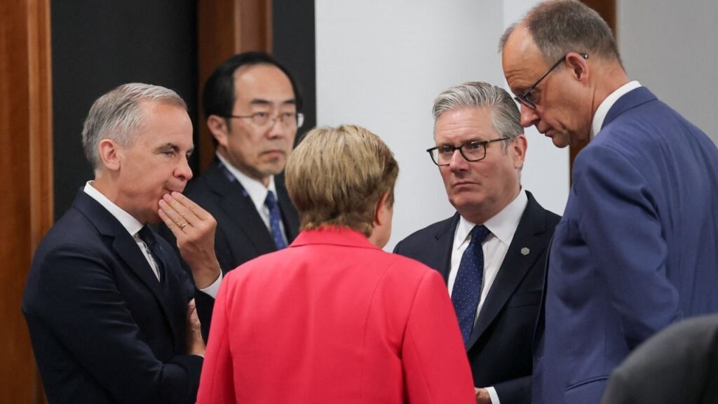 Managing Director of the International Monetary Fund (IMF) Kristalina Georgieva, British Prime Minister Keir Starmer, Canadian Prime Minister Mark Carney and German Chancellor Friedrich Merz talk as they arrive for a working session with G7 leaders and outreach partners on promoting economic growth, during the G7 Summit in Evian-les-Bains, France, June 17, 2026. (Reuters/Christian Hartmann)