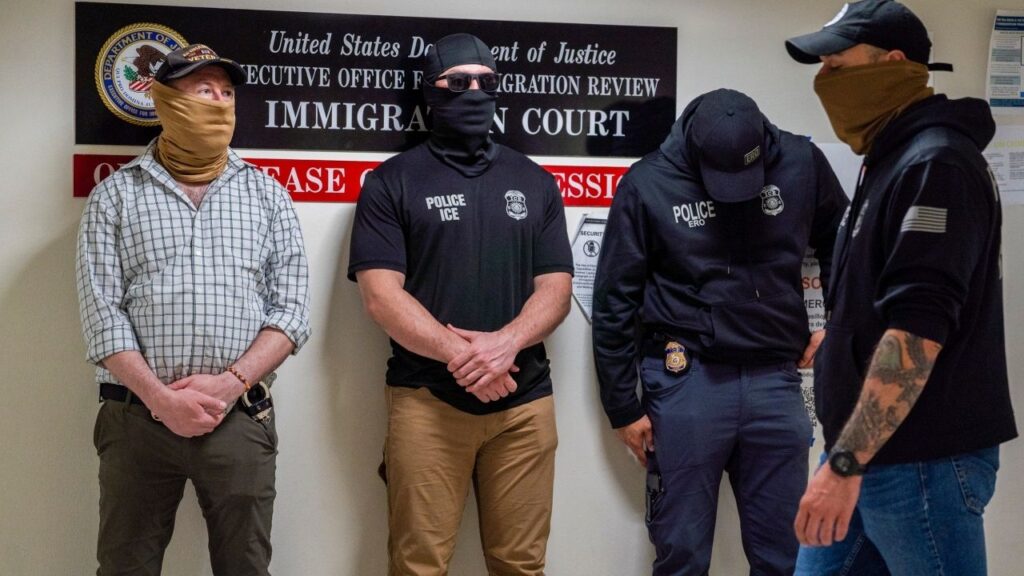 Masked federal immigration officers stand outside an immigration court at 26 Federal Plaza in New York, May 15, 2026. The wearing of masks by federal immigration agents has stoked controversy in New York and other Democratic states. (Madison Swart/The New York Times)