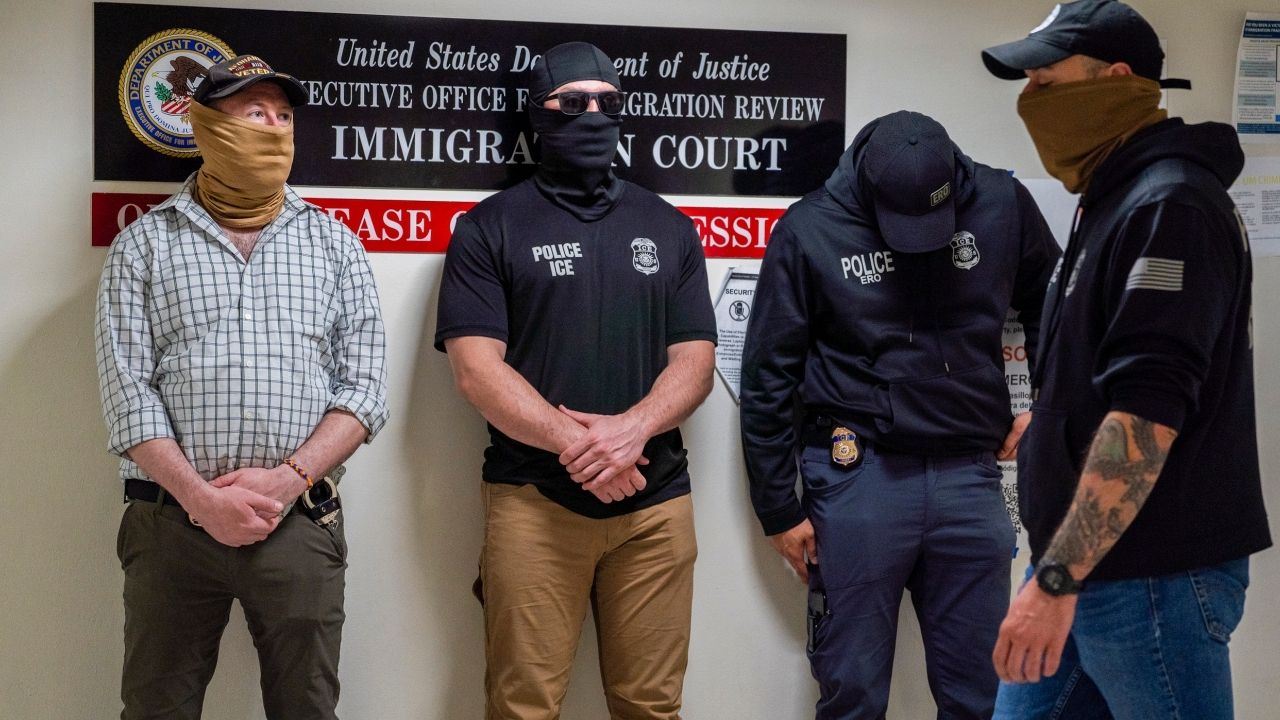 Masked federal immigration officers stand outside an immigration court at 26 Federal Plaza in New York, May 15, 2026. The wearing of masks by federal immigration agents has stoked controversy in New York and other Democratic states. (Madison Swart/The New York Times)