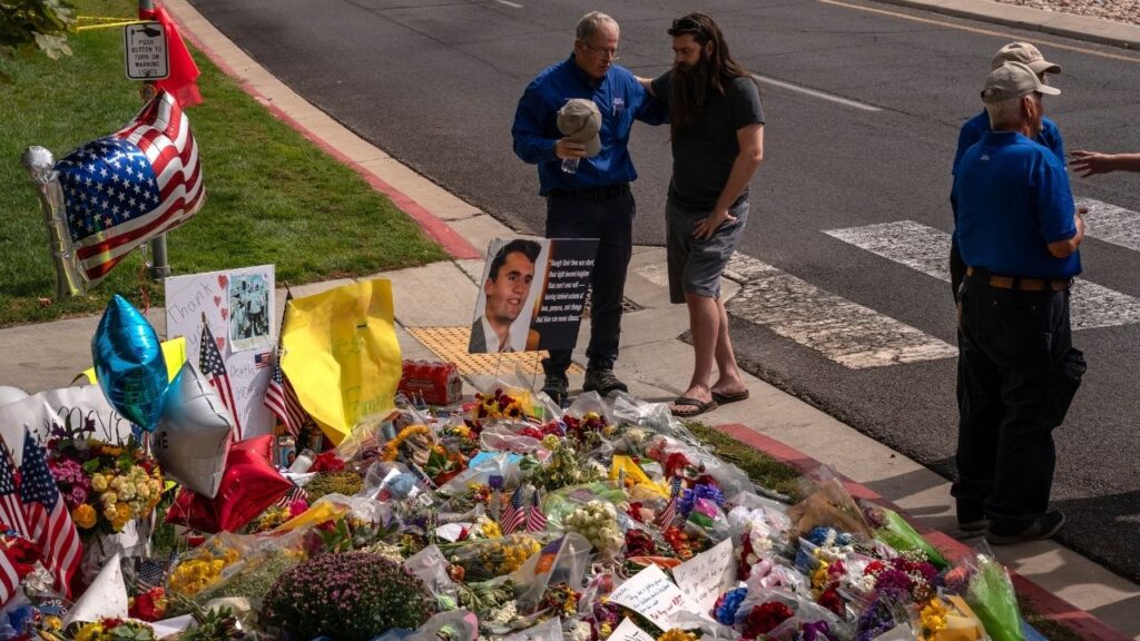 People pray by a makeshift memorial for Turning Point USA founder Charlie Kirk in Orem, Utah, on Sept. 13, 2025, after he was killed during an event at Utah Valley University. A Utah judge overseeing the murder trial in Kirk’s killing held the prosecution in contempt of court on Friday, June 26, 2026, for telling the online news outlet TMZ that prosecutors had “ample evidence” to win a conviction. (Loren Elliott/The New York Times)
