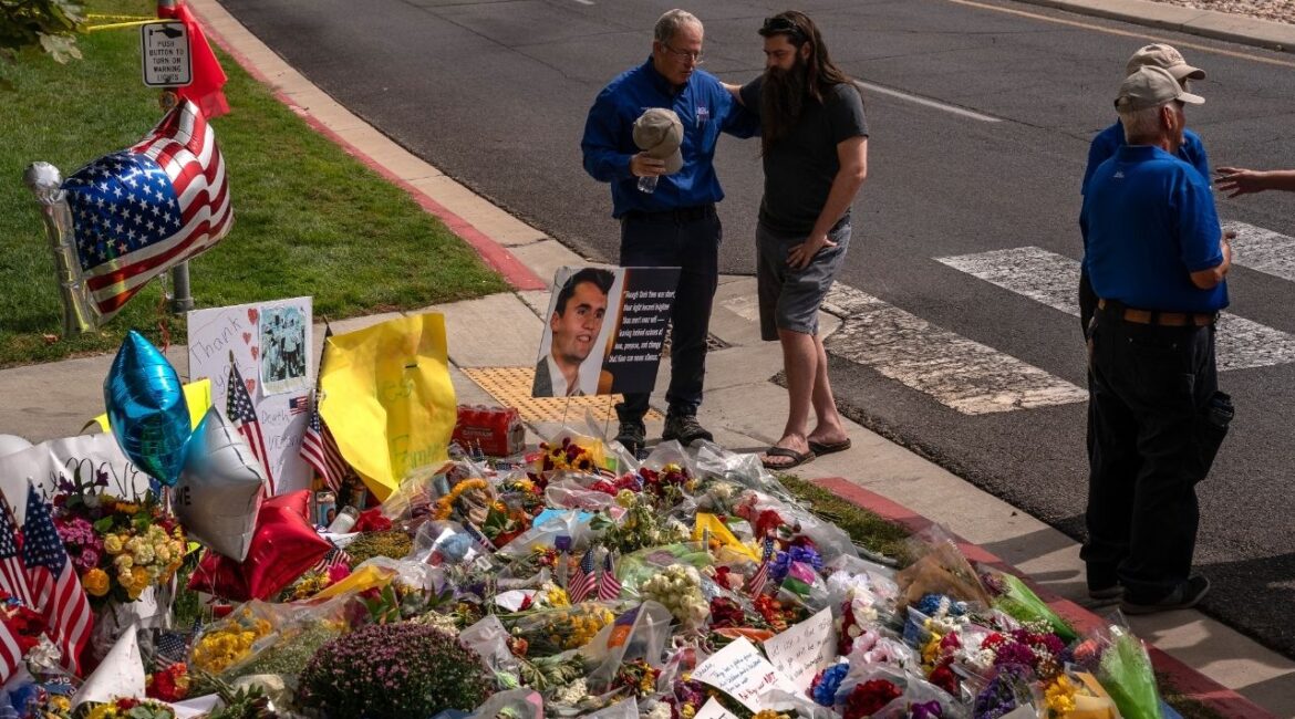 People pray by a makeshift memorial for Turning Point USA founder Charlie Kirk in Orem, Utah, on Sept. 13, 2025, after he was killed during an event at Utah Valley University. A Utah judge overseeing the murder trial in Kirk’s killing held the prosecution in contempt of court on Friday, June 26, 2026, for telling the online news outlet TMZ that prosecutors had “ample evidence” to win a conviction. (Loren Elliott/The New York Times)
