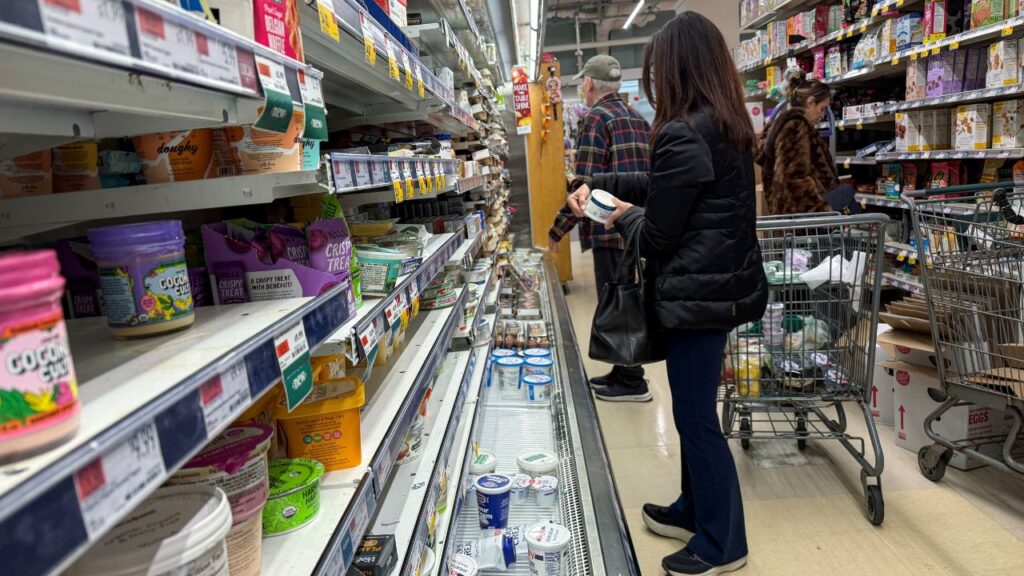 People shop for groceries at a store in Manhasset, New York, U.S., November 19, 2025. REUTERS/Shannon Stapleton