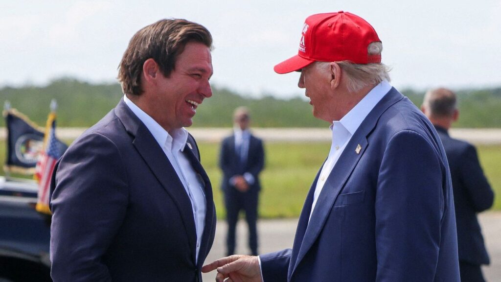 President Donald Trump gestures as he speaks with Florida Governor Ron DeSantis at the Dade-Collier Training and Transition Airport on the day of the opening of a temporary migrant detention center informally known as "Alligator Alcatraz" in Ochopee, Florida, U.S., July 1, 2025. (Reuters File)