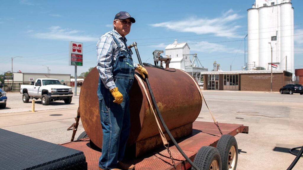 Farmer Gerald Wolff pumps diesel fuel into a fuel tank to take it back to his farm in Harper, Kansas, U.S., May 11, 2018. Picture taken May 11, 2018. (Reuters/File Photo)