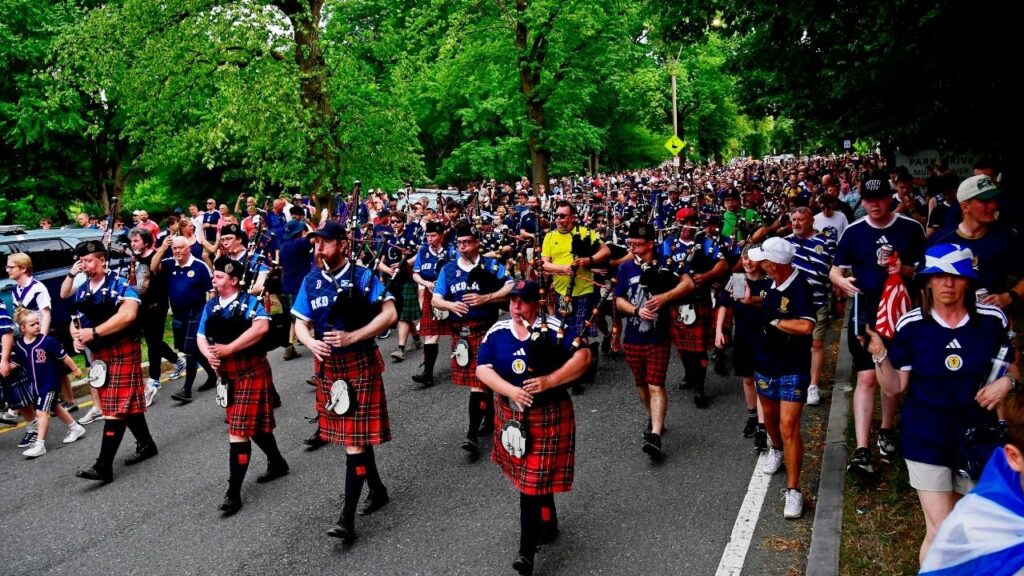 Soccer Football - FIFA World Cup 2026 - Scotland's Tartan Army march to Boston's Fenway Park baseball stadium - Boston, Massachusetts, U.S. - June 14, 2026 Scotland fans wearing kilts and playing the bagpipes during the march to Fenway Park IMAGN IMAGES via Reuters/Bob Dechiara