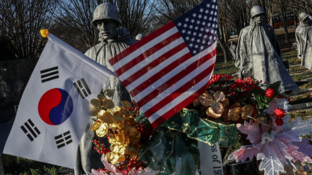 South Korea and U.S. flags are seen at the Korean War Veterans Memorial in Washington, D.C., U.S. December 24, 2025. REUTERS/Tyrone Siu