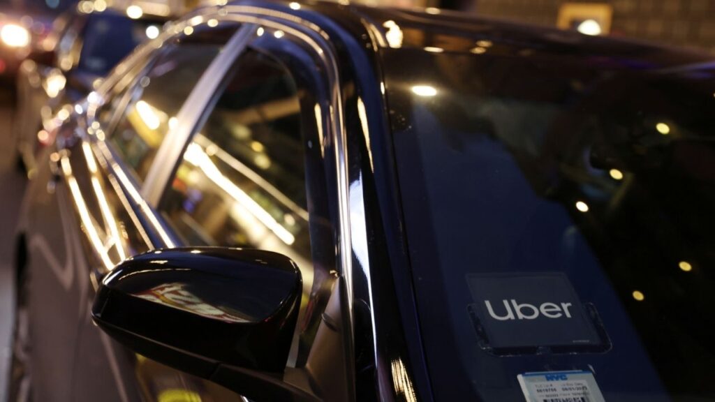 The logo for Uber Technologies is seen on a vehicle in Manhattan, New York City, New York, U.S., November 17, 2021. REUTERS/Andrew Kelly