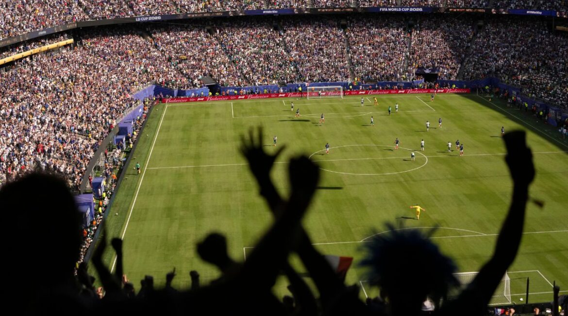 Fans react during the 2026 FIFA World Cup soccer match between France and Senegal at New York New Jersey Stadium in East Rutherford, N.J., June 16, 2026. TSome visiting sports fans are charmed by the United States. The country is even more charmed by them. (Hiroko Masuike/The New York Times)