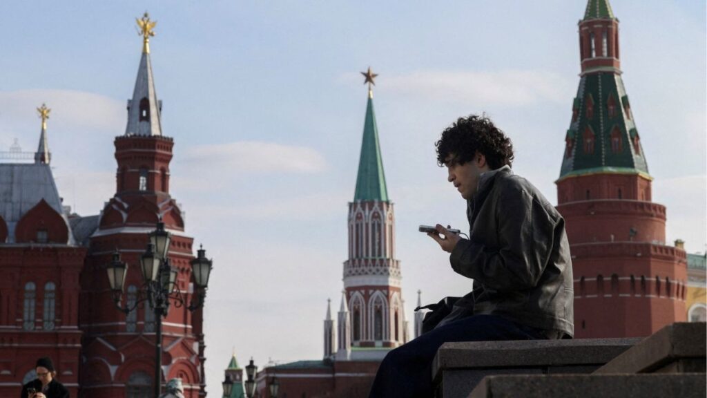 A man checks his mobile phone in central Moscow, Russia, March 17, 2026. Reuters/Ramil Sitdikov/File Photo