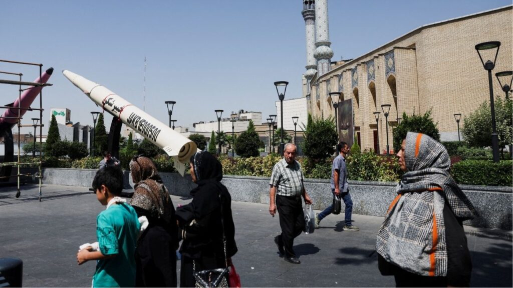 People walk next to a symbolic mock-up of an Iranian missile, on a street in Tehran, Iran, June 11, 2026. Majid Asgaripour/WANA (West Asia News Agency) via Reuters