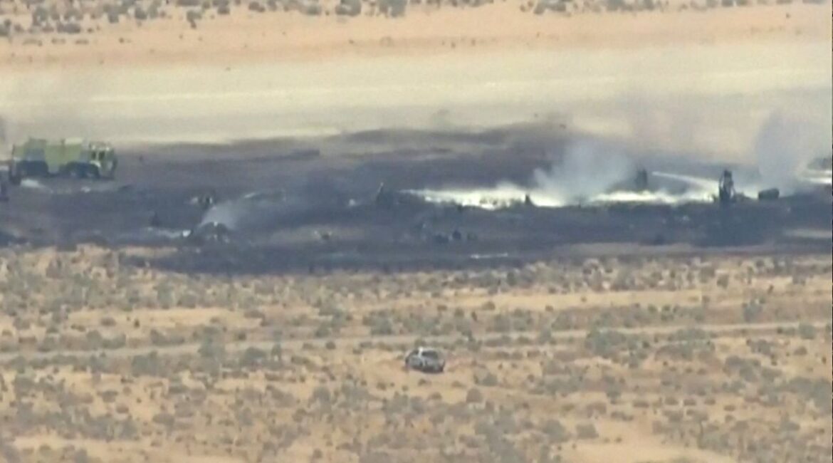 Smoke rises from a blackened part of Edwards Air Force Base after the crash of a U.S. Air Force B-52 bomber aircraft in Edwards, California, U.S., June 15, 2026, in a still image from news helicopter video. (ABC Affiliate KABC via REUTERS)