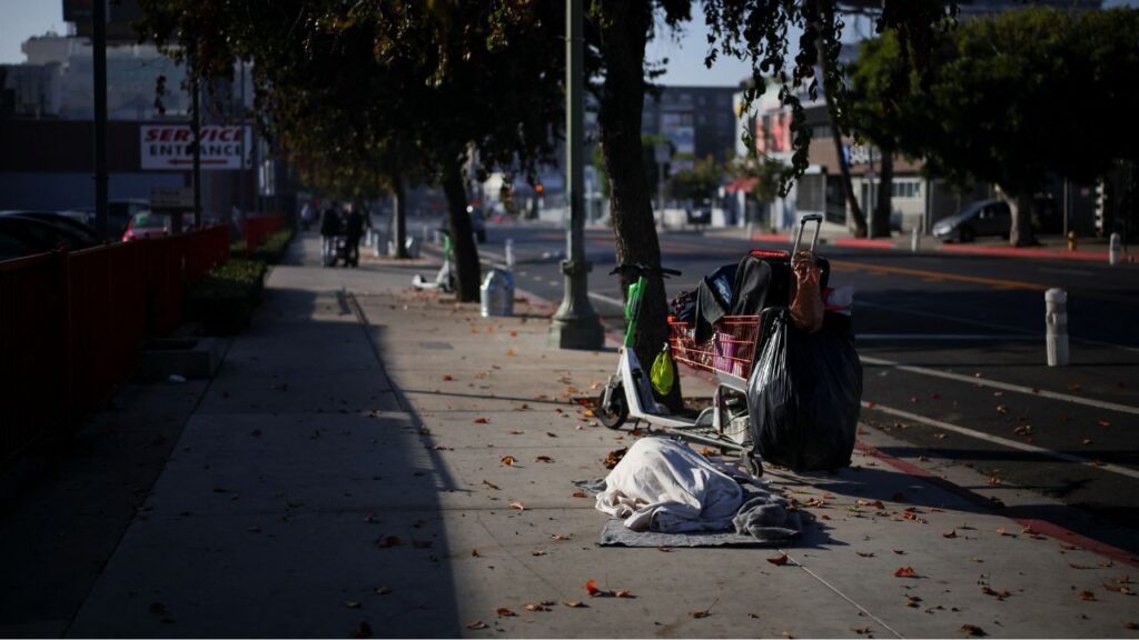 A person sleeps on Hollywood Boulevard in Los Angeles, California, U.S., December 9, 2024. (REUTERS/Daniel Cole)
