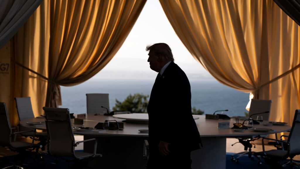 Picture of President Trump facing left in silhouette with gold curtains and a desk in the background