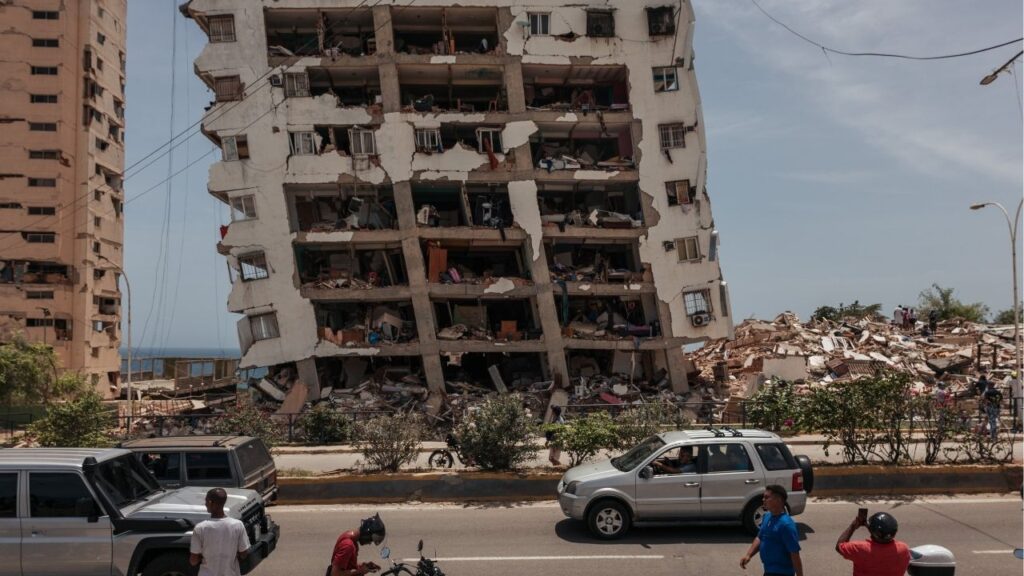 A resident enters a partially-collapsed residential building that was damaged in an earthquake on Wednesday in La Guaira, Venezuela, on Thursday, June 26, 2026. After years of head-spinning crises, Venezuela finally appeared to be on the cusp of an economic rebirth. Then, the twin earthquakes this week upended everything. (Adriana Loureiro Fernandez/The New York Times)