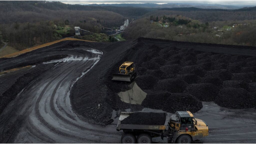 Workers transport and organize mounds of coal on a hilltop near an Arch Coal facility in Beckley, West Virginia, U.S., April 11, 2025. (Reuters File)