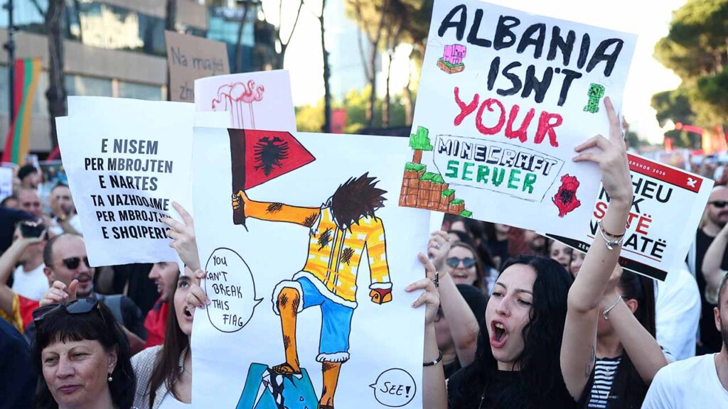 Protesters hold banners during a protest against a luxury resort development planned by a company linked with Donald Trump's son-in-law, Jared Kushner, on an environmentally sensitive part of the Adriatic coast, in Tirana, Albania, June 4, 2026. (Reuters/Florion Goga)