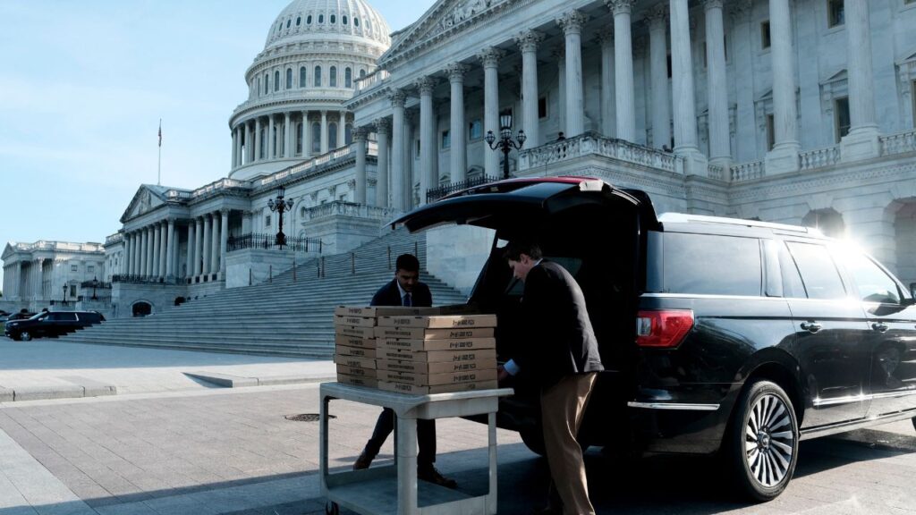 Congressional staff unload boxes of pizza outside the Capitol during a “vote-a-rama” on Capitol Hill in Washington, on Thursday, June 4, 2026. Republicans on Thursday defeated an initial effort by Democrats to bar President Trump from establishing a fund that could compensate his political allies. (Michael A. McCoy/The New York Times)