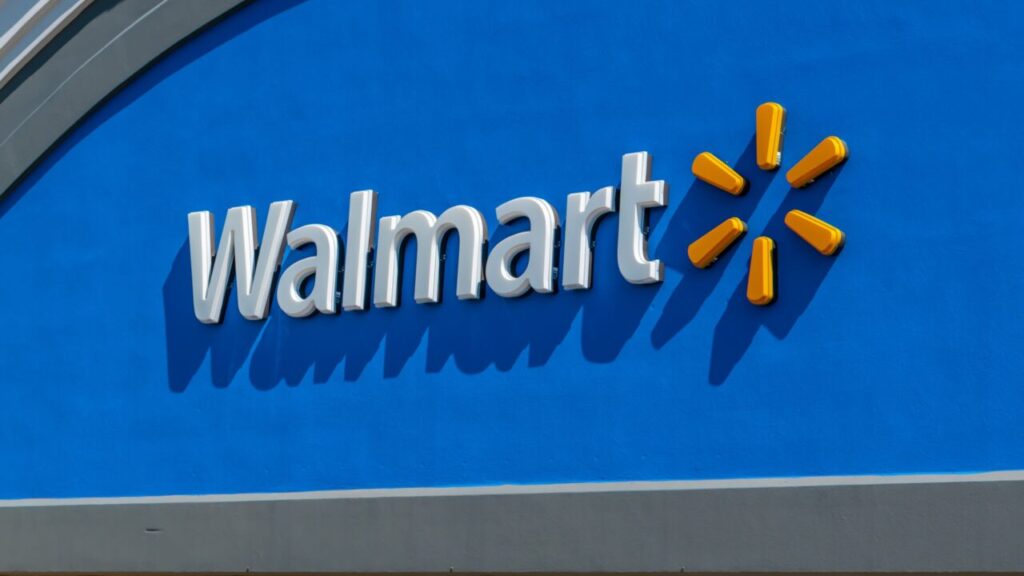 Image of a Walmart Logo in white and gold against a blue backdrop