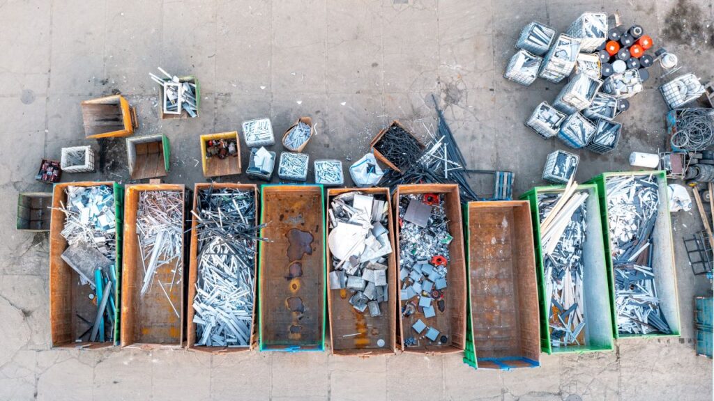 Overhead view of recycled metal in wooden bins