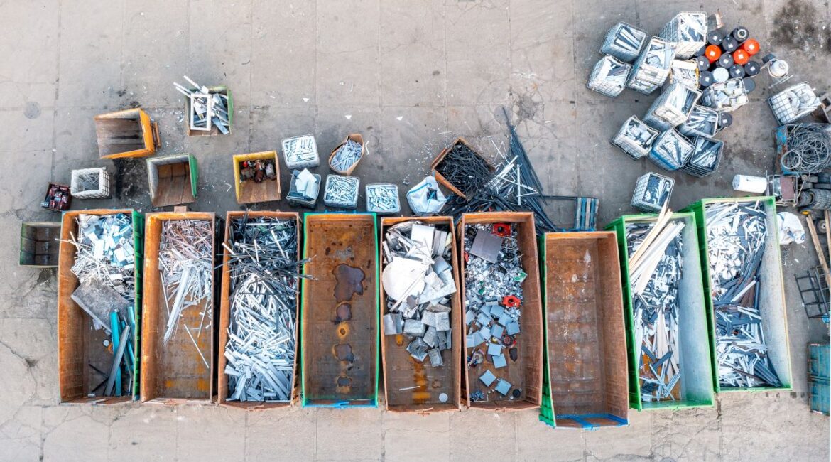 Overhead view of recycled metal in wooden bins