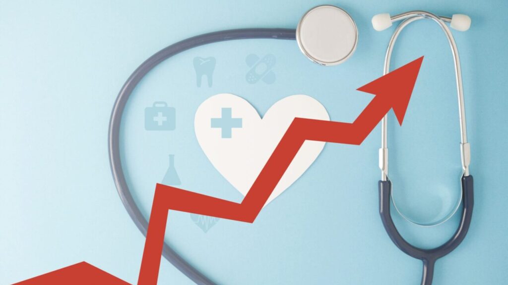 Composite image of a stethoscope and a rising red arrow symbolizing health insurance rate increases