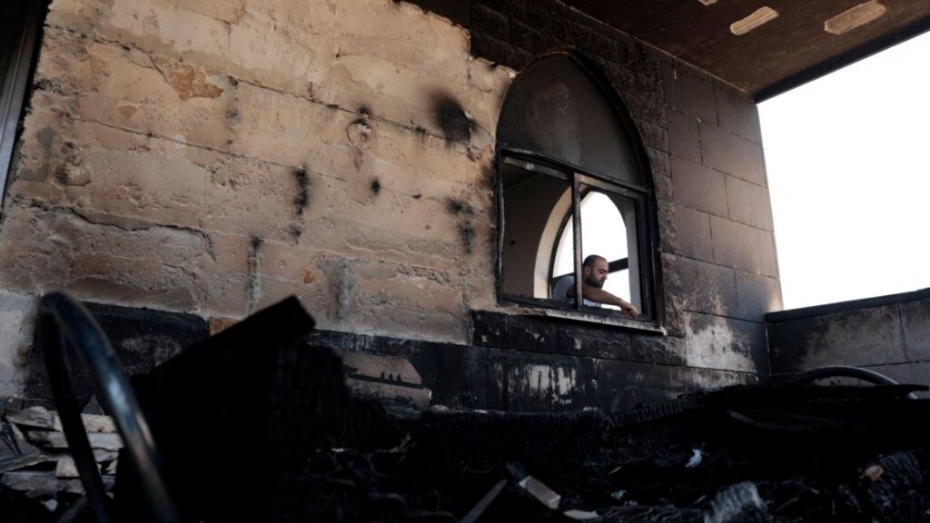 A Palestinian man inspects the damage at a mosque, which Palestinians say was damaged by Israeli settlers, in Qusra near Nablus, in the Israeli-occupied West Bank, July 26, 2026. (Reuters File)