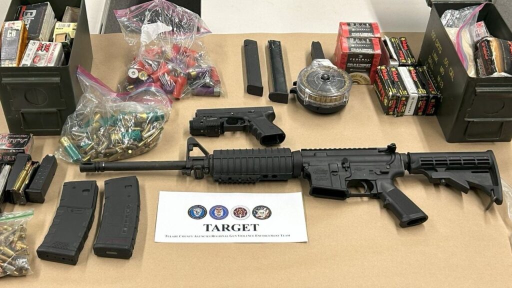 A Visalia man was arrested after a multi-agency firearms investigation led to the seizure of a stolen AR-15 style rifle, a Glock pistol, large-capacity magazines and ammunition. (Visalia PD)