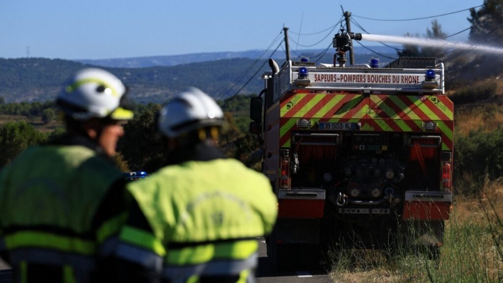 A fire truck sprays water to contain a wildfire in Lancon-Provence near Marseille, France, July 2, 2026. (Reuters/Manon Cruz)
