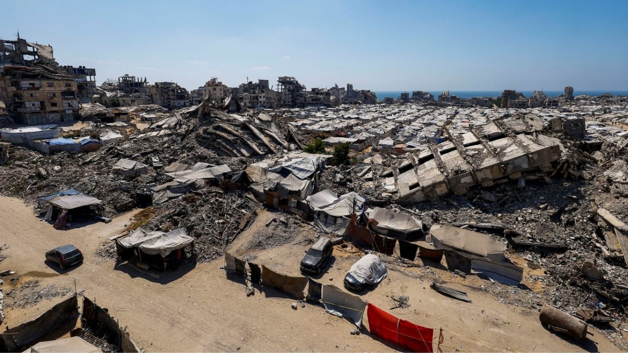 A general view of the rubble of residential buildings destroyed during the Israeli offensive and tents sheltering displaced Palestinians in Gaza City, July 4, 2026. (Reuters/Mahmoud Issa)