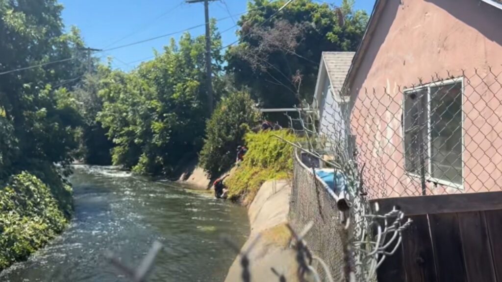 A man was hospitalized Tuesday after jumping into a Fresno canal to rescue his dog, and both were safely rescued by firefighters. (Fresno FD)
