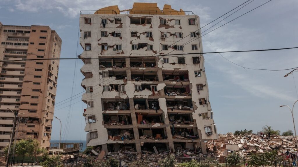A partially-collapsed residential building that was damaged during twin earthquakes in La Guaira, Venezuela, June 25, 2026. Any large earthquake can be dangerous, but the residents of Caracas and Venezuelan coastal cities like La Guaira and Catia La Mar were victims of several unlucky factors. (Adriana Loureiro Fernandez/The New York Times)
