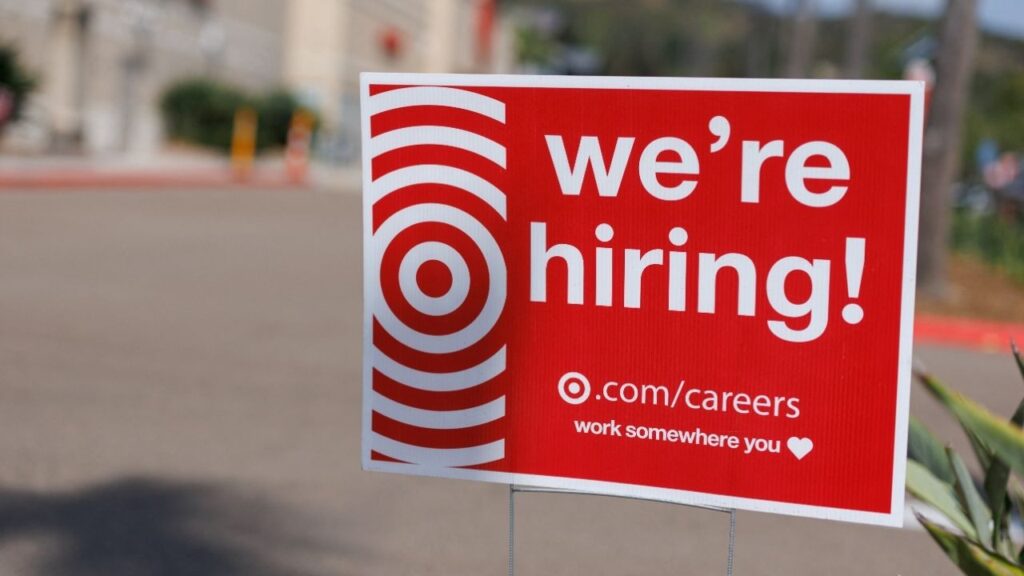 A "we're hiring" sign is displayed outside a Target store, after U.S. employment growth slowed more than expected in July, in Encinitas, California, U.S. August 1, 2025. (Reuters/Mike Blake)