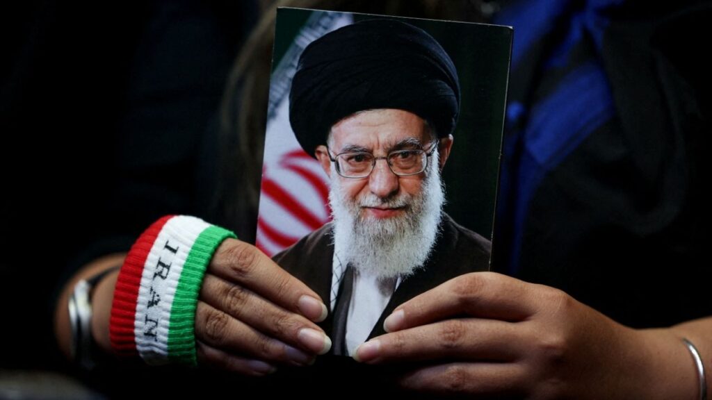 A woman holds an image of late Iranian Supreme Leader Ayatollah Ali Khamenei during a rally in Tehran, Iran, May 29, 2026. (Reuters File)