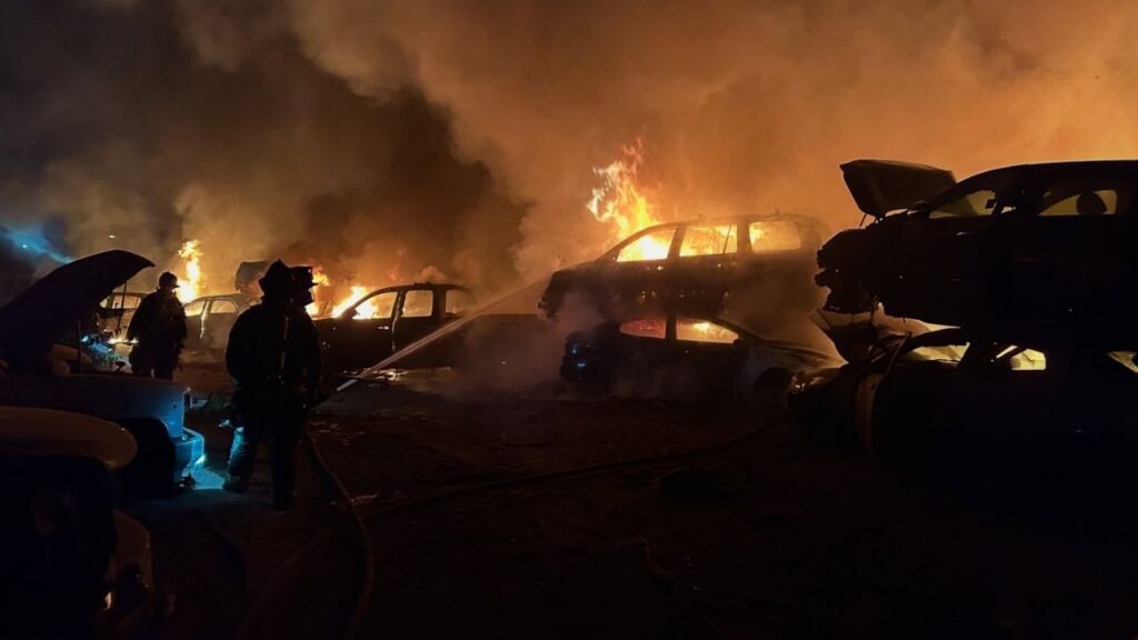About 100 vehicles burned at a Modesto auto wrecking yard Sunday morning, but firefighters prevented the blaze from spreading and no injuries were reported. (Modesto FD)