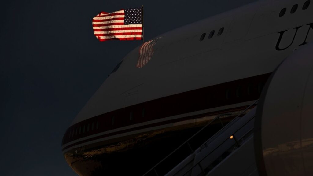 An American flag flies above the new Air Force One plane as President Donald Trump arrives at Ellsworth Air Force Base in South Dakota, July 3, 2026. The decision for the president to leave Ankara on an older Air Force One aircraft came at the request of the Secret Service. The swap deepens questions about the security retrofitting of the new plane. (Doug Mills/The New York Times)