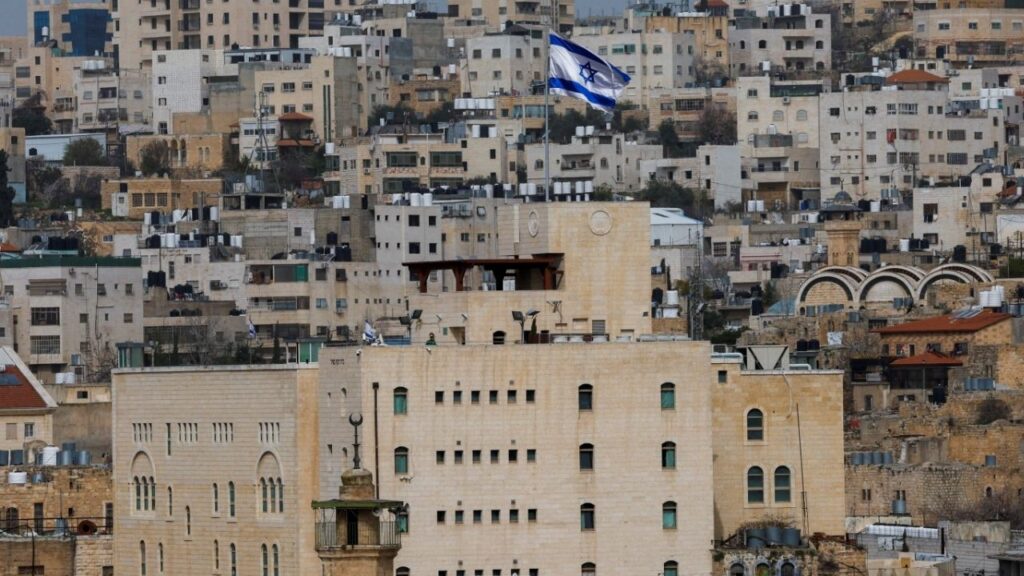 An Israeli flag flies over an Israeli settlement in the old city in Hebron in the Israeli-occupied West Bank, February 9, 2026. (Reuters File)