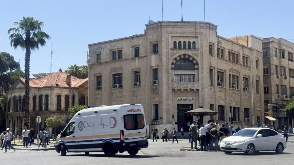 An ambulance drives past the site where explosive devices blew up near a hotel where French President Emmanuel Macron was meant to be staying, in Damascus, Syria, July 7, 2026. Picture taken with a mobile phone. REUTERS/Yamam Al Shaar