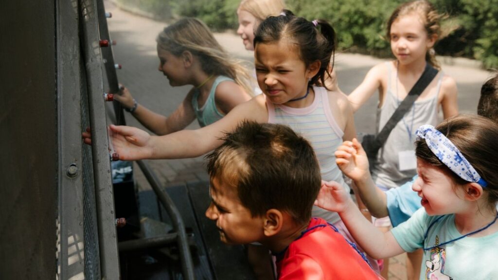 Children taking part in the Cincinnati Zoo summer camp play in misters in Cincinnati, Ohio, on Thursday, July 2, 2026. Temperatures in parts of the Northeast reached triple digits by midday as the region slogged through a hot spell that has already scorched the Midwest. (Madeleine Hordinski/The New York Times)