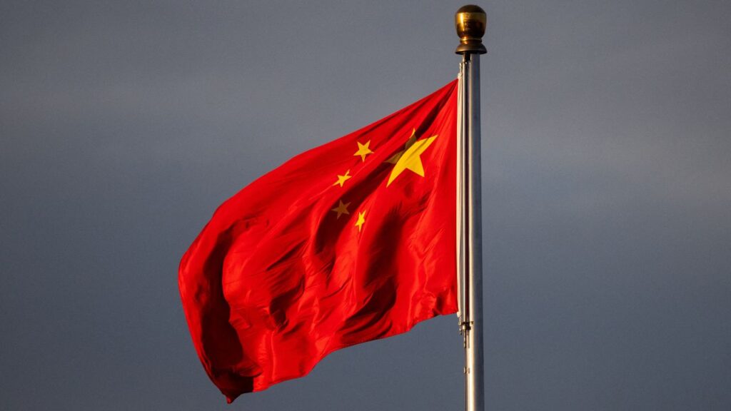China’s national flag flutters in the wind lit by sunrise in Beijing, China, November 20, 2025. (REUTERS/Maxim Shemetov)