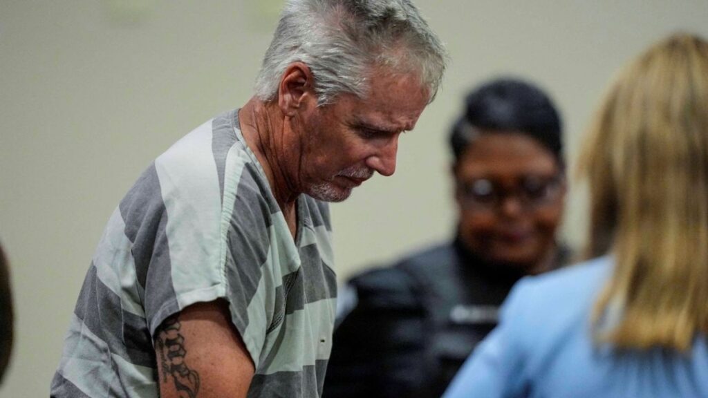 Colin Gray, 54, the father of Apalachee High School shooter Colt Gray, 14, who is charged as an adult with four counts of murder in the deaths of Mason Schermerhorn and Christian Angulo, both 14, Richard Aspinwall, 39, and Cristina Irimie, 53, enters the Barrow County courthouse for his first appearance, in Winder, U.S., September 6, 2024. Brynn Anderson/Pool via REUTERS