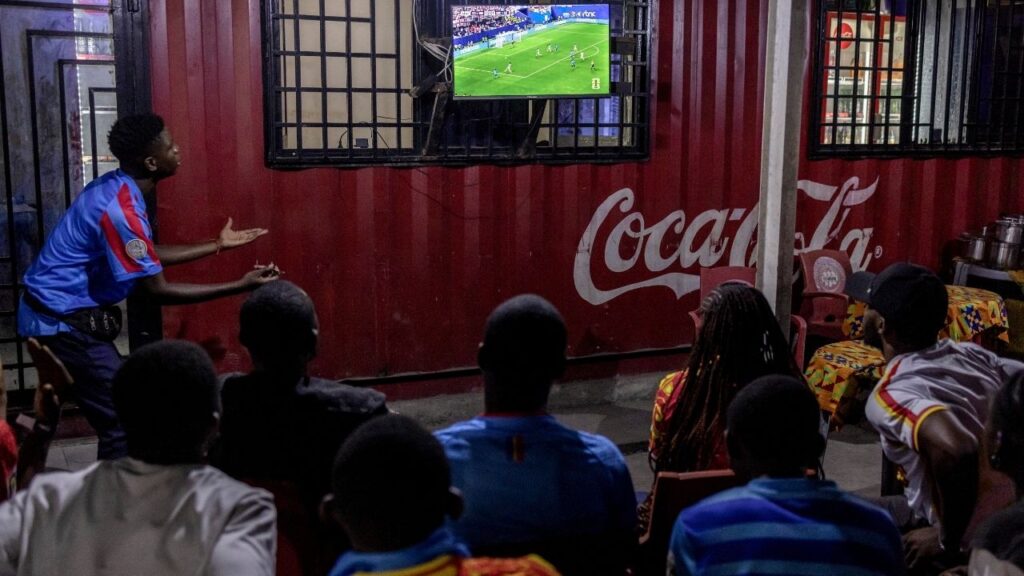 Congolese fans react as they watch the World Cup round of 32 soccer match between England and Congo on a screen in Kinshasa, Democratic Republic of Congo, Wednesday, July 1, 2026. It had been more than 50 years since the nation had made it to the World Cup; at the time, it was called Zaire. (Finbarr O'Reilly/The New York Times)
