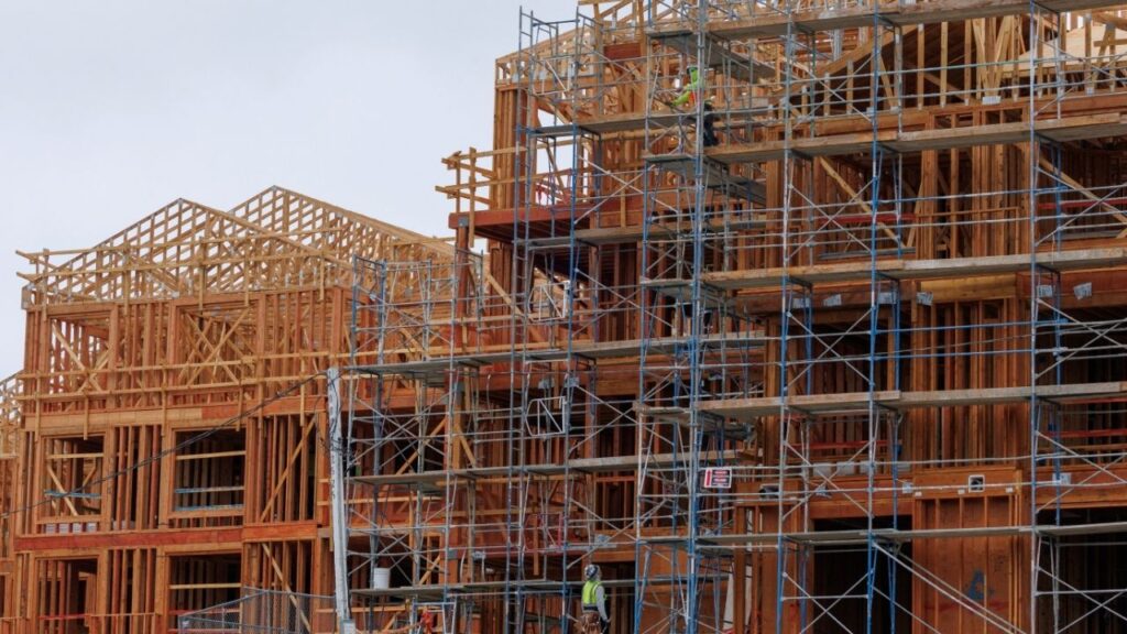 Construction crew members work on a multi-unit residential housing building in Encinitas, California, U.S., October 6, 2025. (Reuters/Mike Blake)
