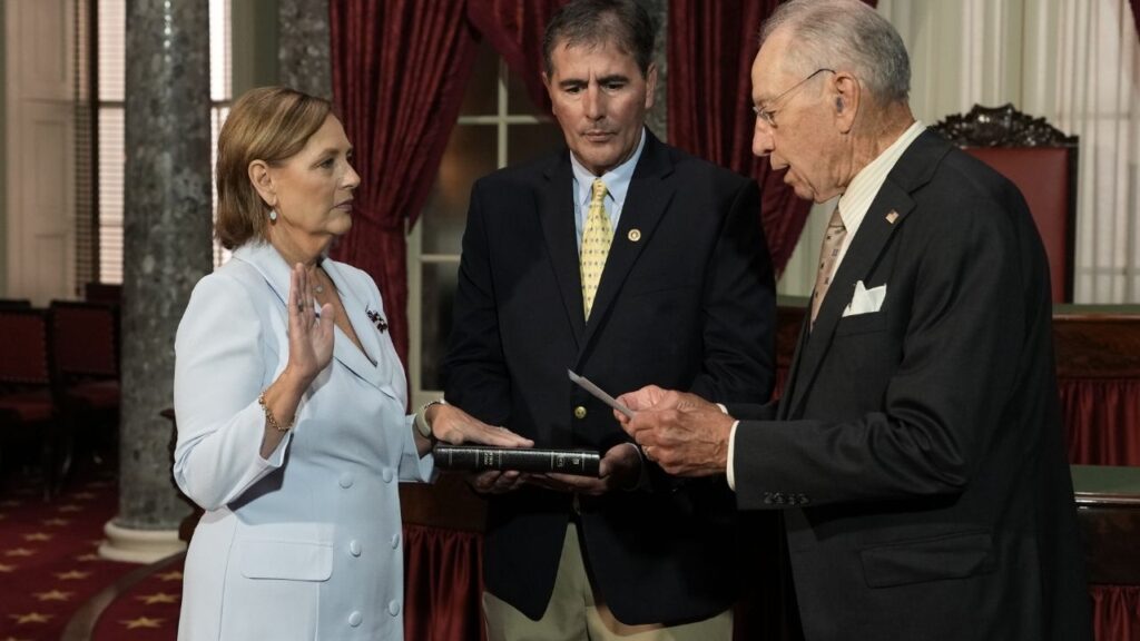 Darline Graham Nordone, left, the sister of Sen. Lindsey Graham (R-S.C.), who died on Saturday, is sworn into office by Sen. Chuck Grassley (R-Iowa), right, as her husband, Larry Nordone, looks on, on Capitol Hill in Washington, on Tuesday, July 14, 2026. Darline Graham Nordone was tapped on Monday by Gov. Henry McMaster of South Carolina to fill her brother’s seat and serve the remainder of his term ending in January 2027. (Alex Kent/The New York Times)