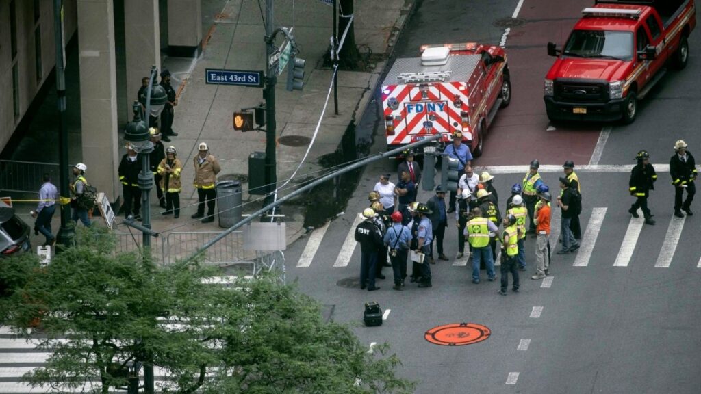 Emergency workers gather in midtown Manhattan after several buildings were evacuated due to the potential collapse of one of them on Tuesday, July 7, 2026. The evacuation led to city officials shutting down a major thoroughfare during commuter hours, and at a peak time of tourism in the city. (Dave Sanders/The New York Times)