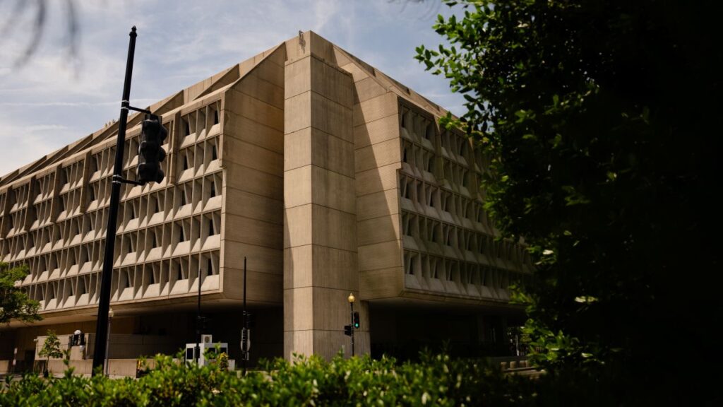 Image of the Department of Health and Human Services, a multistory light brown building, in Washington, D.C.