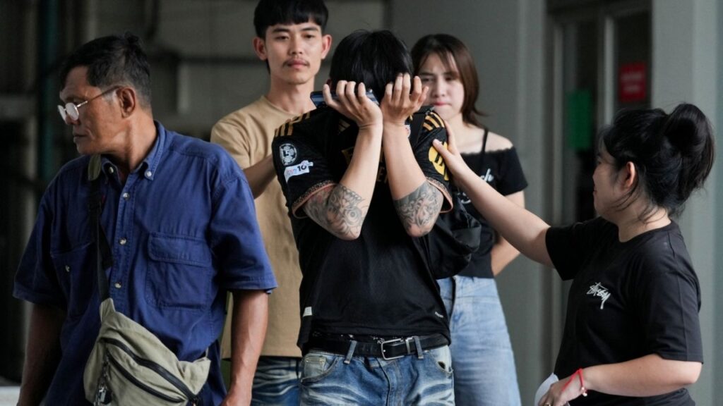 Family members and relatives mourn as they receive the body of a victim at the Police Hospital morgue, following a deadly fire at a pub in Bangkok, Thailand, July 13, 2026. (Reuters/Arnun Chonmahatrakool)